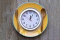 Food clock. Healthy food concept on wooden table background Royalty Free Stock Photo