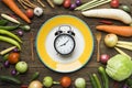 Food clock. Healthy food concept on wooden table Royalty Free Stock Photo