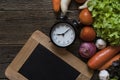 Food clock. Healthy food concept on wooden table Royalty Free Stock Photo