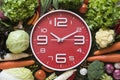 Food clock. Healthy food concept on wooden table Royalty Free Stock Photo