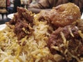 Food closeup view famous traditional kacchi biryani with potato.