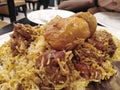 Food closeup view famous traditional kacchi biryani with potato.