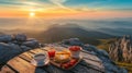 Food and coffee on wood table at mountain top at sunrise or sunset, amazing breakfast with stunning landscape view. Concept of