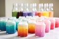 food coloring bottles lined up near icing cakes Royalty Free Stock Photo