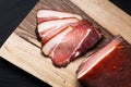 Food concept Artisan Fresh smoked Bacon on wood cutting board with copy space