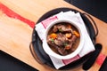 Food concept French red wine beef stew bourguignon on wooden board with copy space Royalty Free Stock Photo