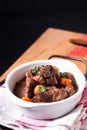 Food concept French red wine beef stew bourguignon on wooden board with copy space Royalty Free Stock Photo