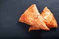 Food concept Fresh bake Homemade meal beefs or chicken triangle puff pie on slate stone