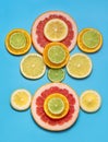 Food concept. Fruit background. Sliced citrus fruit on a blue background. Flat lay, top view. Royalty Free Stock Photo