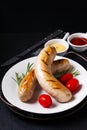 Food concept Grilled BBQ White sausages on black background with copy space Royalty Free Stock Photo