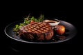 Grilled meat steak on plate in black background with copy space Royalty Free Stock Photo