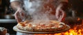 Food concept. A happy professional chef presents freshly prepared pizza from the oven Royalty Free Stock Photo