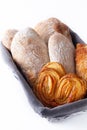 Food concept homemade artisan classic Italian style yeast dough Ciabatta bread and assortment puff pie in bread basket