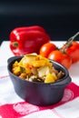 Food concept Homemade French organic Ratatouille in white bake ceramic bowl on blask slate stone board Royalty Free Stock Photo