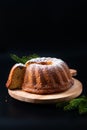 Food Concept homemade Gugelhupf, Guglhupf, Kugelhopf, kouglof bundt yeast cake of Central Europe on black background