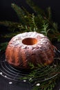 Food Concept homemade Gugelhupf, Guglhupf, Kugelhopf, kouglof bundt yeast cake of Central Europe on black background