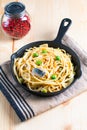 Food concept homemade spaghetti creamy white sauce in cast-iron skillet pan on wood Royalty Free Stock Photo