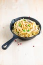 Food concept homemade spaghetti creamy white sauce in cast-iron skillet pan on wood