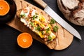 Food concept organic french Sourdough toasted with eggs and ham on wooden cutting board