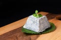 Food concept organic Valencay cheese PDO pyramid shape on wooden board with copy space