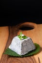 Food concept organic Valencay cheese PDO pyramid shape on wooden board with copy space