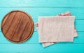 Food concept. Pizza Cutting board and tablecloth on blue wooden background. Top view and copy space. Place for text. Mock up. Cafe Royalty Free Stock Photo