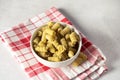 Food Concept Raw Organic Italian Fusili Pasta in White Bowl on Napkin Gray Background Above