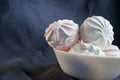 food, confection and sweets concept - close up of zephyr or marshmallow dessert on plate Royalty Free Stock Photo