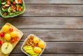 Food container with healthy food on wooden background top view mock up Royalty Free Stock Photo