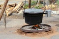 Food is cooked in a cauldron on a fire