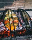 The food is cooked on the grill. Grilled vegetables, grilled fish on the grill Royalty Free Stock Photo