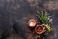 Food cooking background. Fresh herbs bunch thyme and condiments on old black wooden table. Thyme, sea salt and pepper. Food Royalty Free Stock Photo