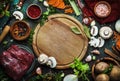 Food cooking background. Fresh organic vegetables, ingredients, spices and meat for warm autumn soup on vintage kitchen table with Royalty Free Stock Photo