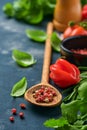 Food cooking background. Fresh rosemary, cilantro, basil, cherry tomatoes, peppers and olive oil, spices herbs and vegetables at b Royalty Free Stock Photo