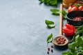 Food cooking background. Fresh rosemary, cilantro, basil, cherry tomatoes, peppers and olive oil, spices herbs and vegetables at b Royalty Free Stock Photo