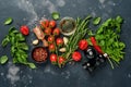 Food cooking background. Fresh rosemary, cilantro, basil, cherry tomatoes, peppers and olive oil, spices herbs and vegetables at Royalty Free Stock Photo