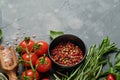 Food cooking background. Fresh rosemary, cilantro, basil, cherry tomatoes, peppers and olive oil, spices herbs and vegetables at Royalty Free Stock Photo