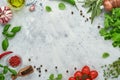 Food cooking background. Fresh saffron, garlic, cilantro, basil, cherry tomatoes, peppers and olive oil, spices herbs and vegetabl Royalty Free Stock Photo