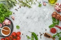 Food cooking background. Fresh saffron, garlic, cilantro, basil, cherry tomatoes, peppers and olive oil, spices herbs and vegetabl Royalty Free Stock Photo