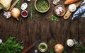 Food cooking background. Ingredients for prepare green lentils with vegetables, spices and herbs, wooden kitchen table background