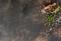 Food cooking background. Spices herbs bunch thyme and seasoning salt and pepper at black slate table. Food ingredients top view Royalty Free Stock Photo