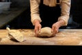 Baker making bread dough at bakery kitchen Royalty Free Stock Photo
