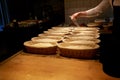 Baker with baskets for dough rising at bakery Royalty Free Stock Photo