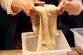 Close up of baker hands making bread dough Royalty Free Stock Photo