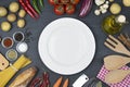 Food and cooking concept Ingredients and big plate top view Royalty Free Stock Photo