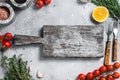 Food cooking and healthy eating background with wooden cutting board and fresh seasoning, herbs and vegetables. Gray Royalty Free Stock Photo