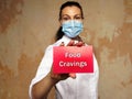 Food Cravings inscription on the sheet Royalty Free Stock Photo