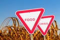 Food crisis concept. Two red road signs. Defocus blank empty triangle red warning road sign on nature background. Hunger Royalty Free Stock Photo