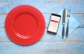 Food delivery concept, smartphone,plate,cutlery,delivery message on screen, copy space Royalty Free Stock Photo