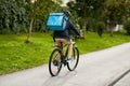 food delivery man with bag riding bicycle